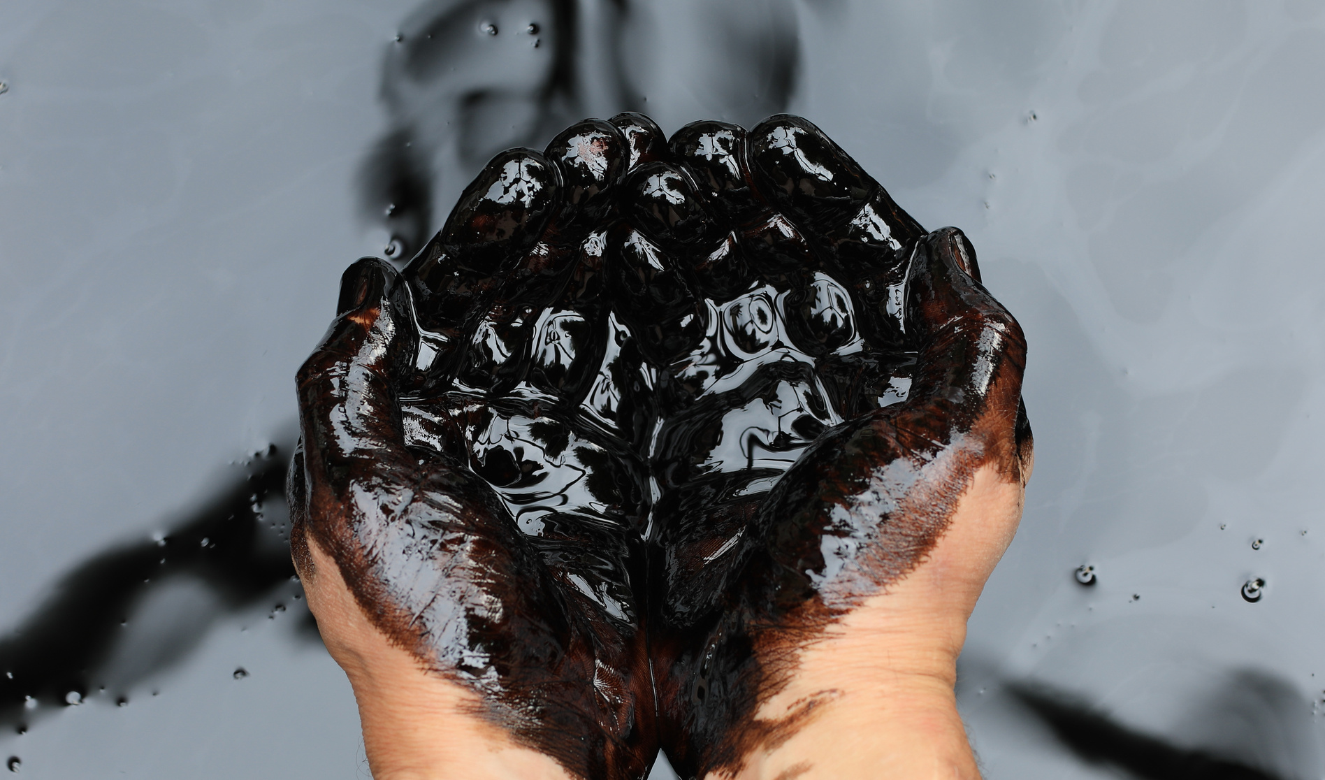 hands in petroleum
